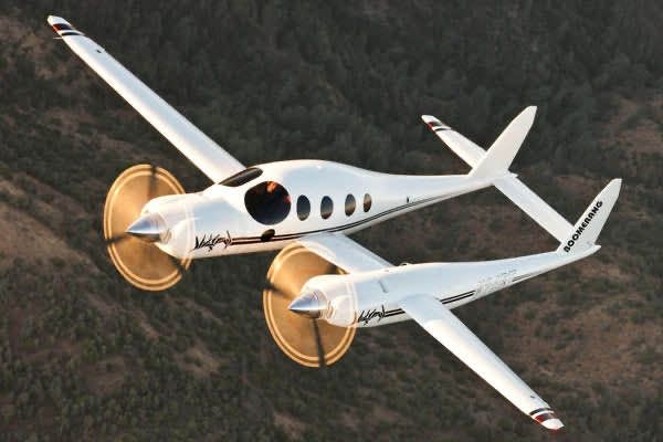 Boomerang plane designed by Rutan, looks like a private jet but with a propeller on the nose and another engine on the left wing, looks very asymmetrical and strange