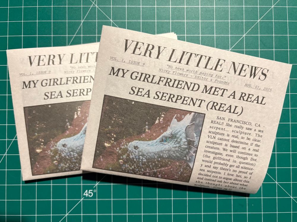 two copies of issue 9 of Very Little News, the smallest ever newspaper in the world made by me