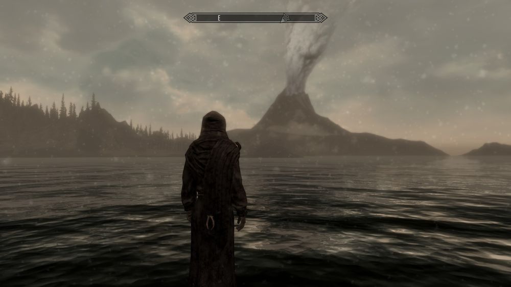 바다 건너 거대한 화산을 바라보는 던머.