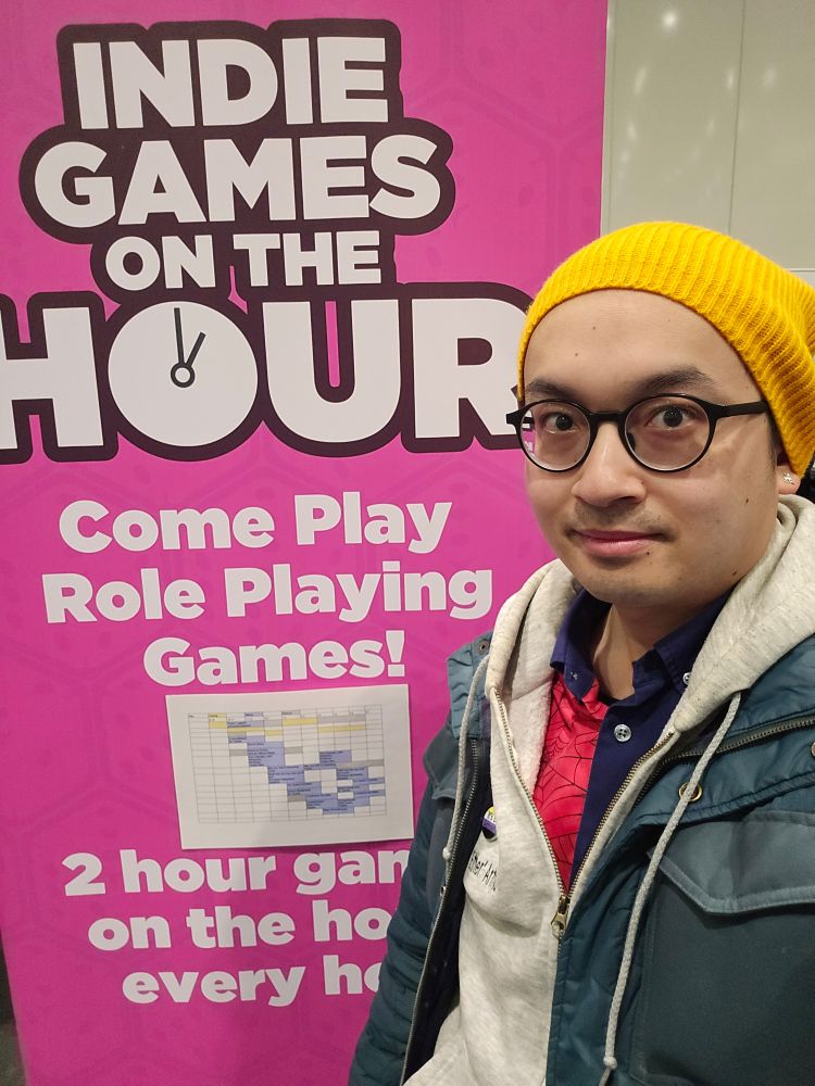 A selfie of me next to indie games on the hour banner.