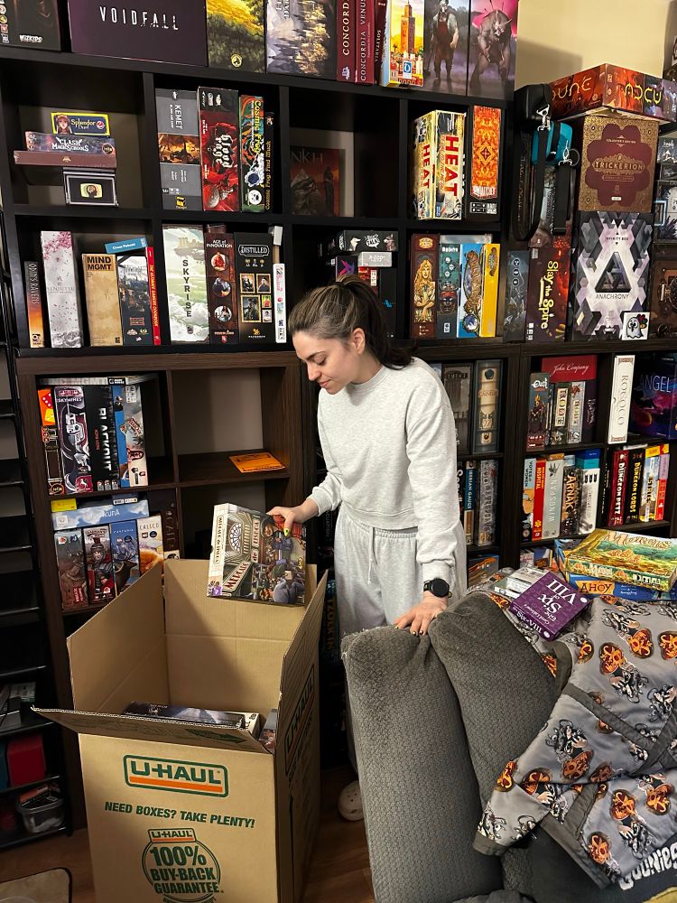 Brain loading boxes with games for her upcoming move