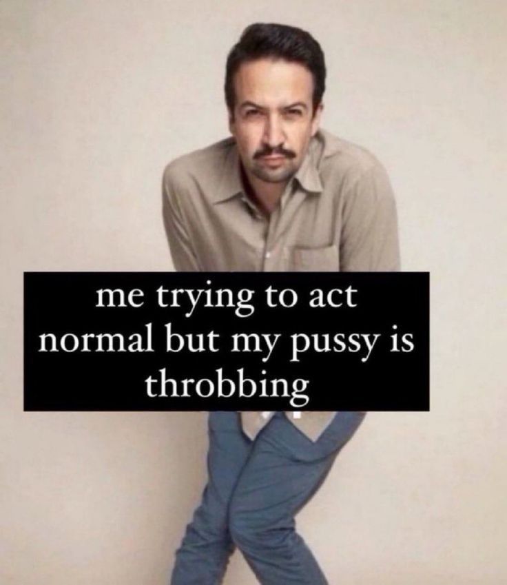 A photo of Lin Manuel Miranda pressing his thighs together with a cunty look on his face. Text added on the image reads: "me trying to act normal but my pussy is throbbing"