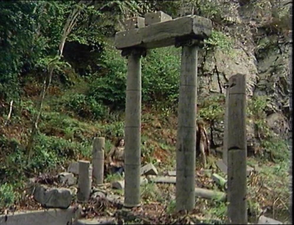 Fake Roman temple ruins in the Welsh countryside. Two surviving pillars hold up a bit of roof.