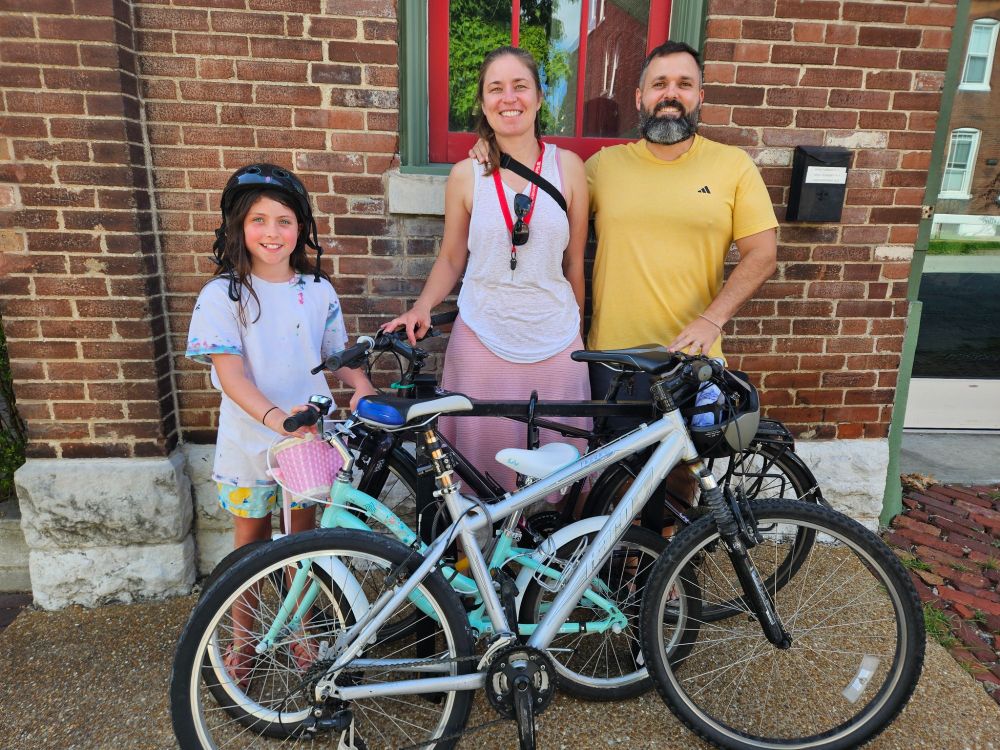 An onsite Earn-A-Bike student rode with her parents to Soulard for Day 3, yesterday morning, of her six-week bike class. They've been riding together every week! And the parentals helped out in the bike shop during the two-hour kids' class.
