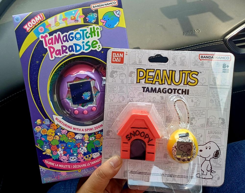 A purple Tamagotchi Paradise, and the Peanuts Tamagotchi Nano