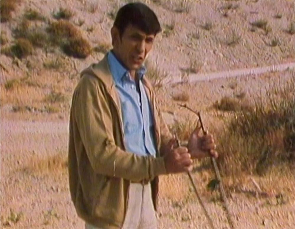 Leonard Nimoy in a camel hoodie with a water dousing rod