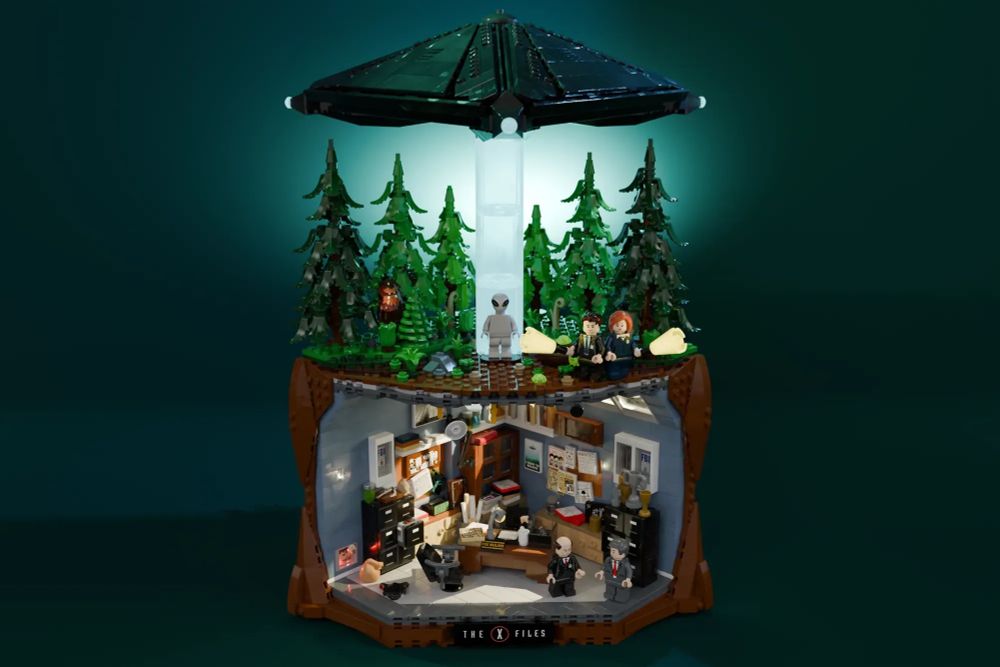 a complete shot of the entire X-Files lego set, showing Mulder's office, above which is a forest scene with a black triangular UFO hovering above