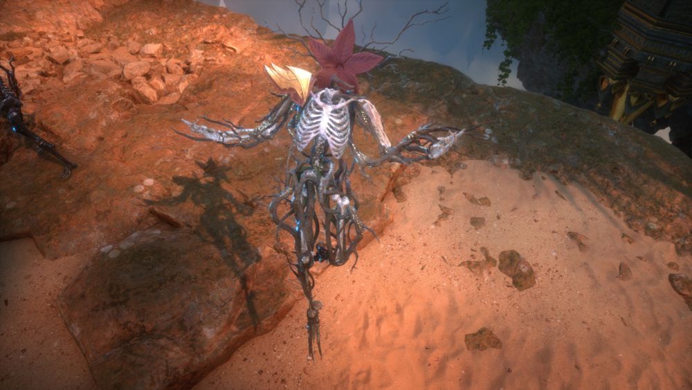 A grey silver skeleton floats in the air above a cliff. It has a red flower for a head, and several root like tendrils coming off of its feet and arms and neck.