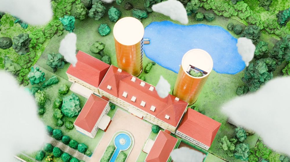 Screenshot from CITY the animation episode 5. This picture shows a diorama of a building with two golden towers.
