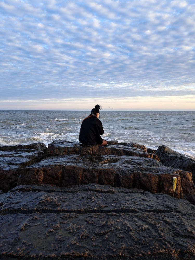 picture of a woman on a jetty 