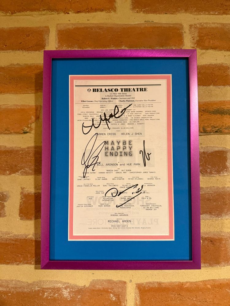 This is a photo of the signed Playbill for the Maybe Happy Ending new Broadway musical. It’s signed by the four original cast members. 

—o—

Thanks for the lovely frame 🖼️ @theframeroom