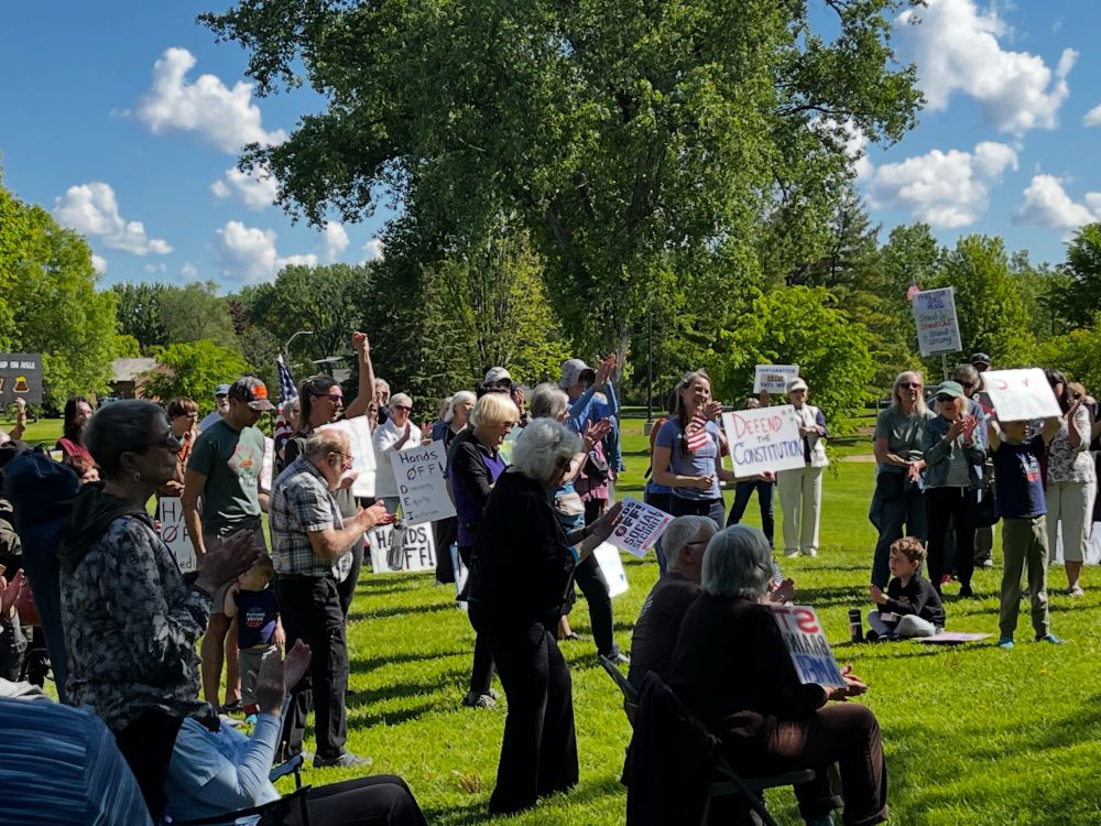 Crowd of protesters/rally participants with signs