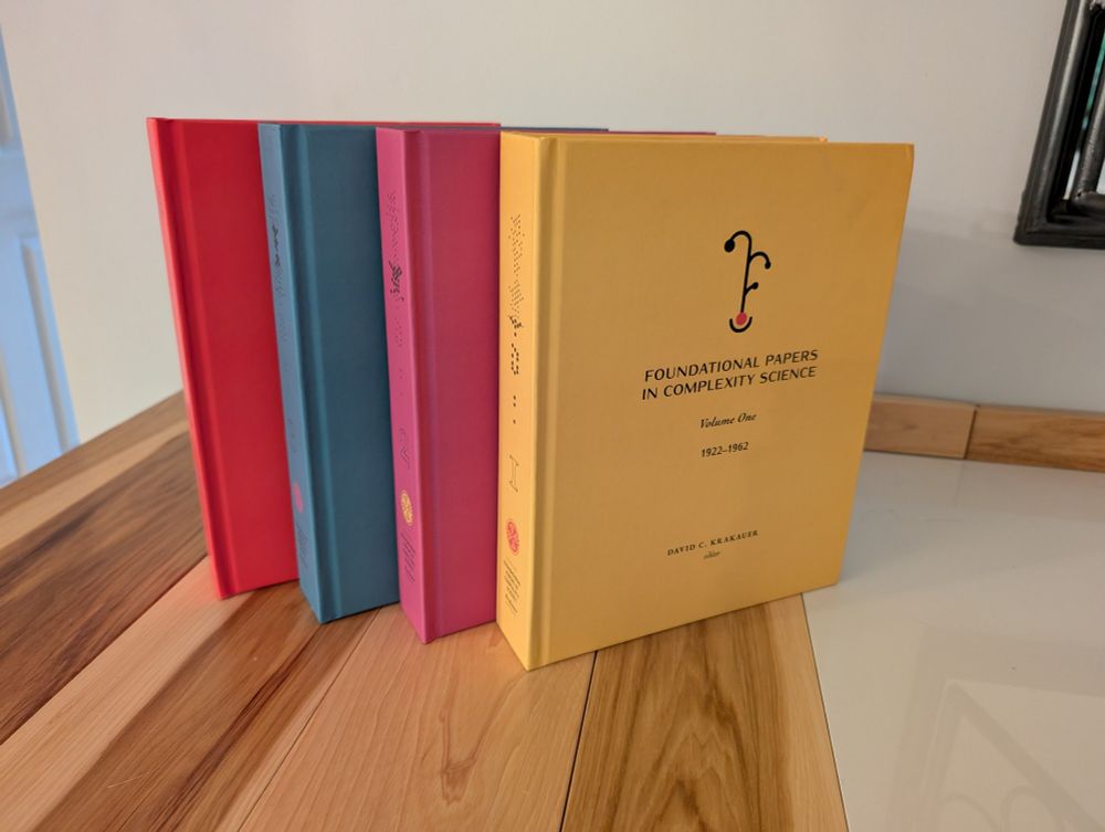 All four hardcover volumes of Fundamental Papers in Complexity Science