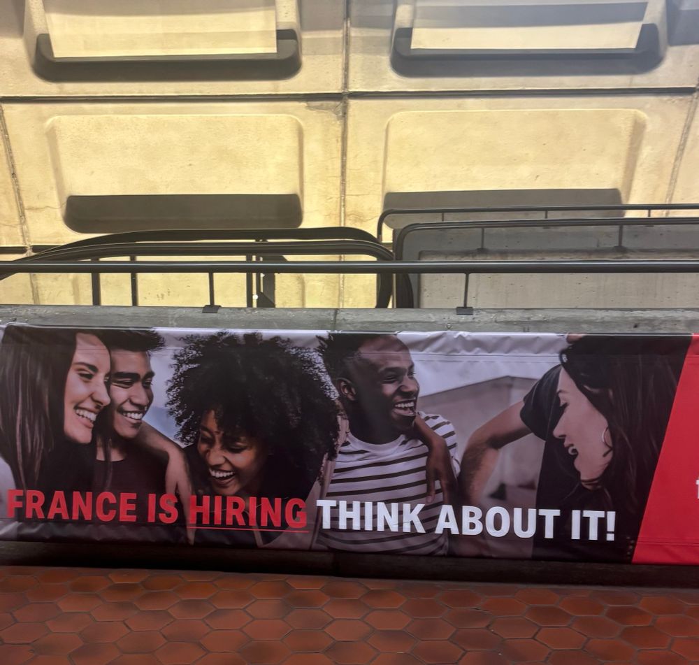 Sign advertising a move to France in the DC metro. 
