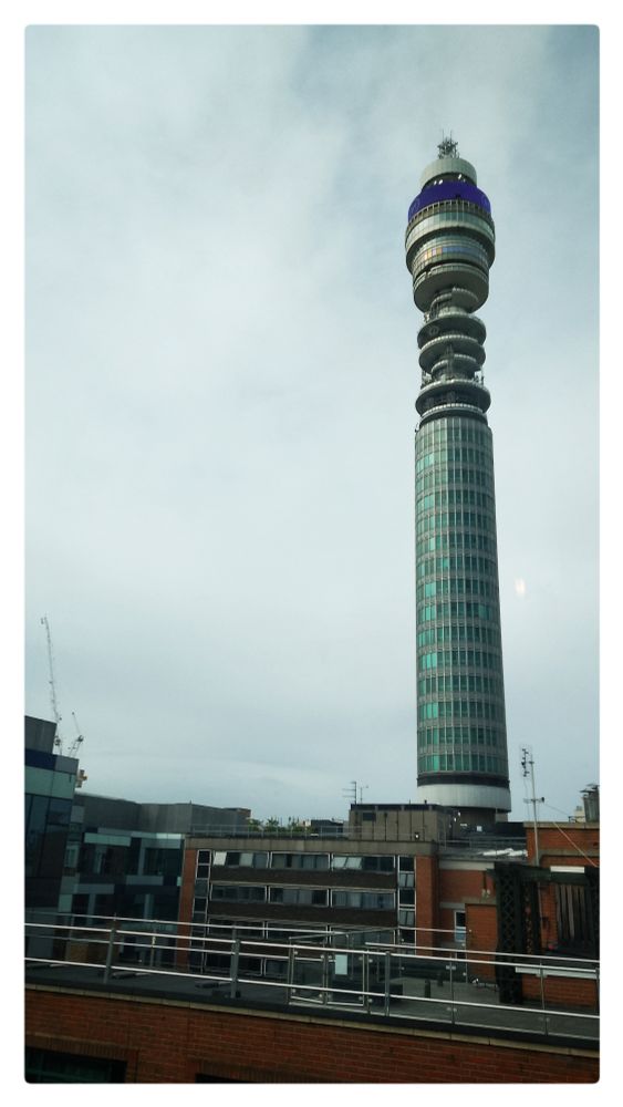 BT Tower on a slightly overcast morning, with other office buildings below