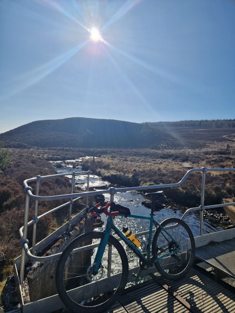 Crossing Balnard Burn near Kirkmichael  Beautiful April sunshine. Gravel Bike resting on the Bridge before slogging up the hill.