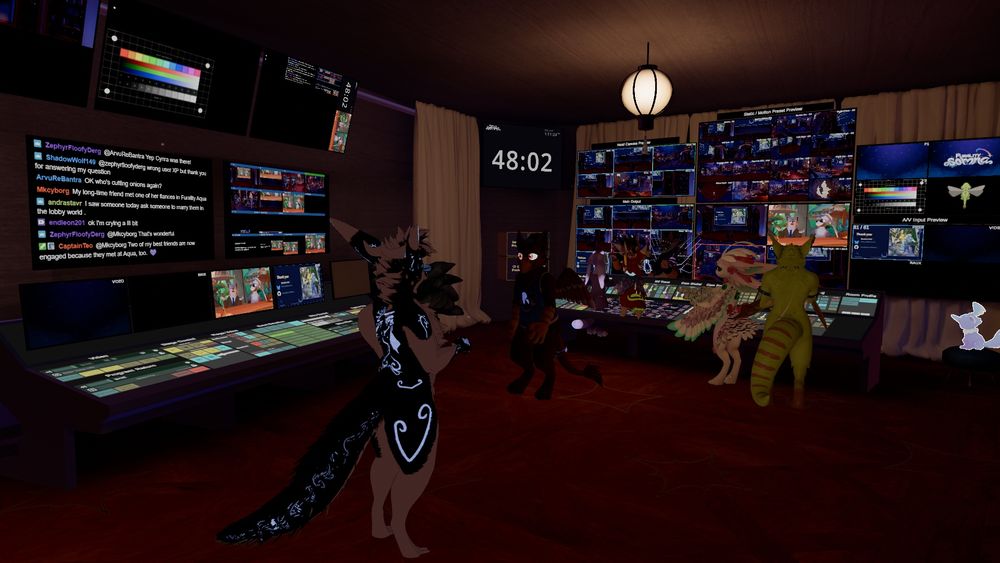 Several staff and attendees hanging out in the Furality event stage control room