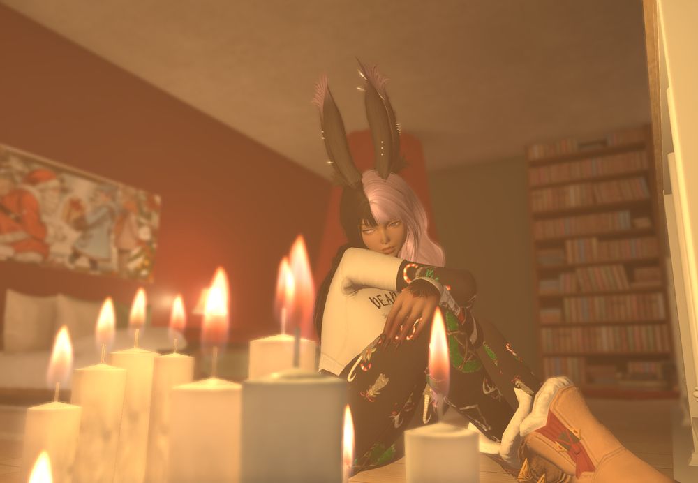 Viserra is sitting on the bedroom floor with her knees to her chest and her arms resting on top of them. Her head is slightly resting on her right arm as she gazes thoughtfully at the candles burning next to. She has on a black bodysuit with a pattern of skulls, candy canes, and wreathes all over. Over that is a crop top with the phrase "dead inside but jolly af". She has Whisperfine woolen boots on to help keep her warm as well.