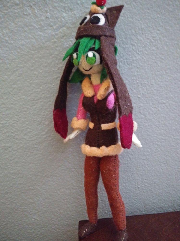 Felt work calamari sundae angled away from the camera slightly, full body show (not holding anything this time and *does* have hat on)