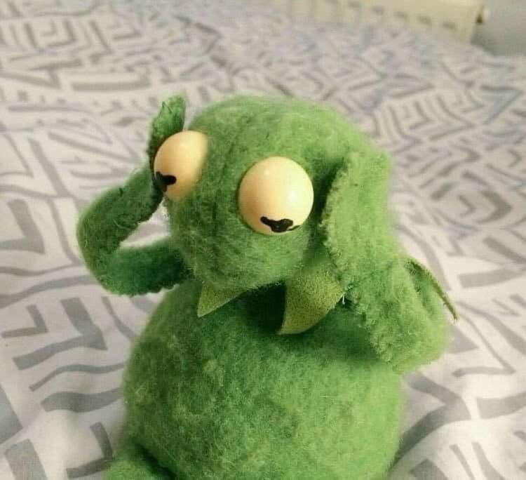 Kermit holding side of his head facing down 