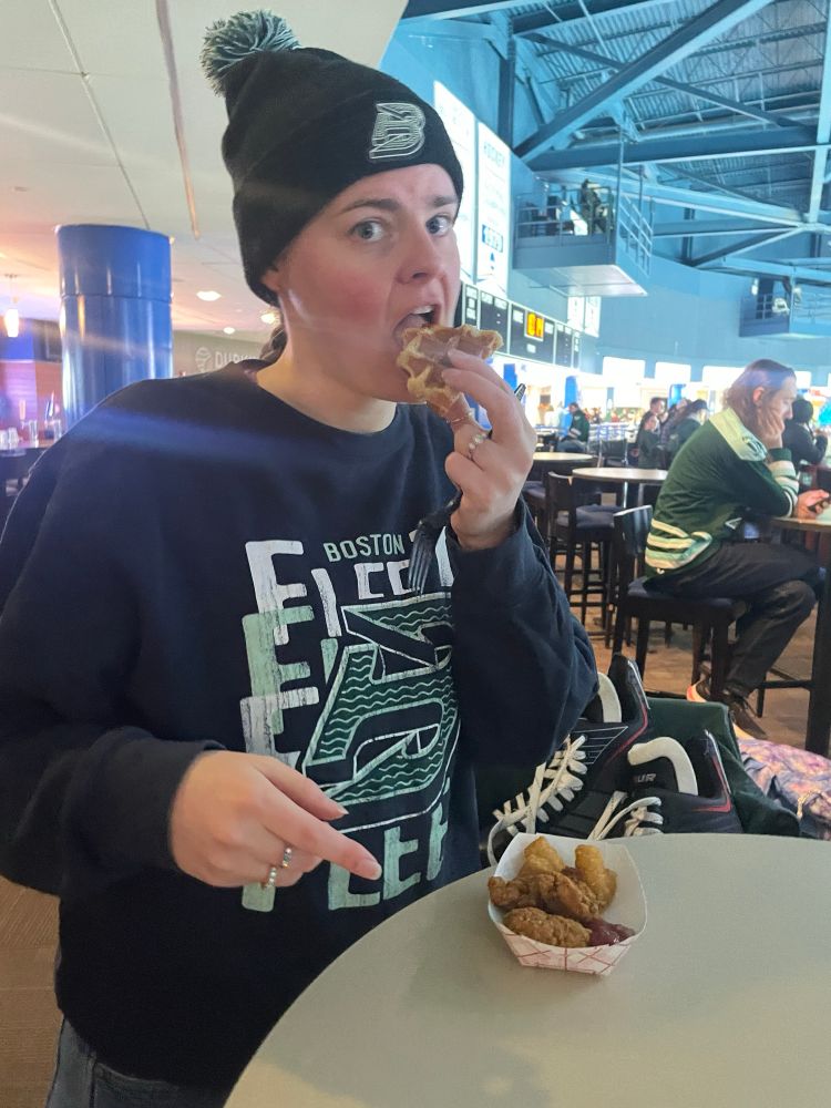 Fiancée eating a waffle with a surprised look on her face :)