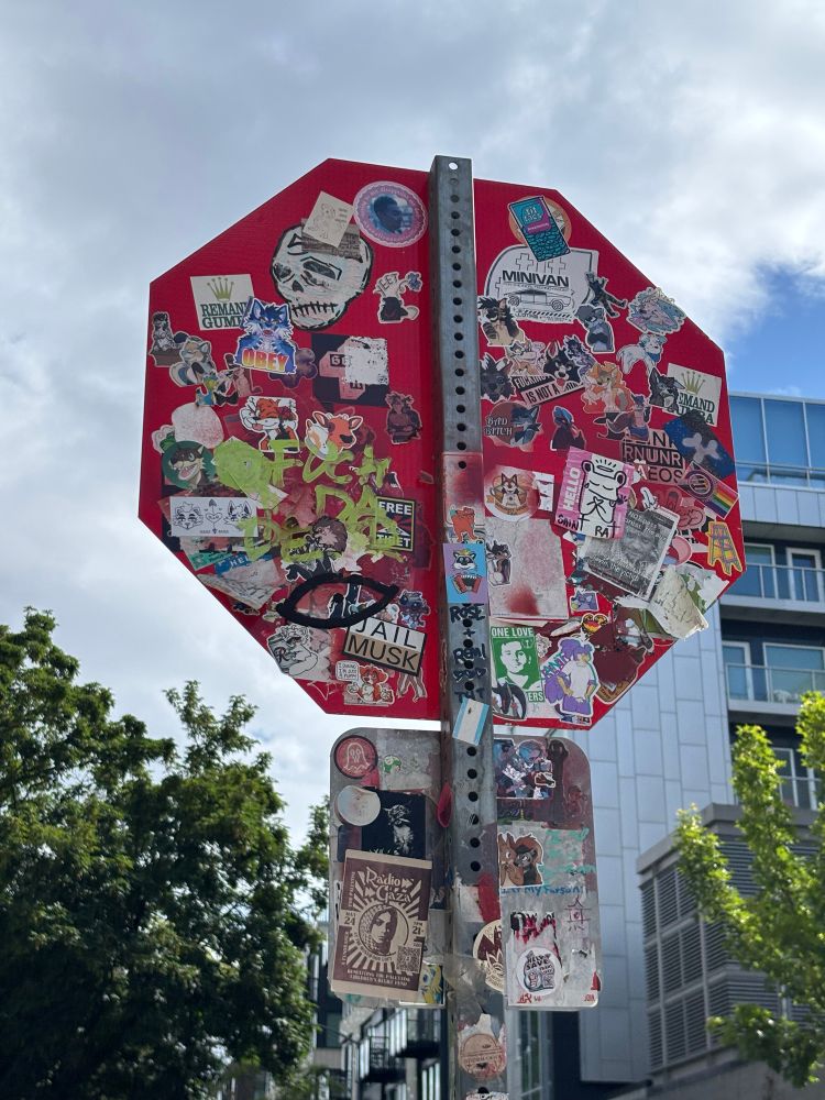 stop sign covered in stickers