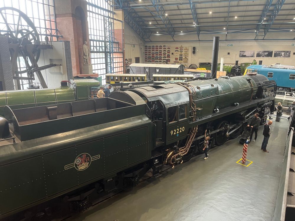 A green steam engine in the Great Hall at York Railway Museum 