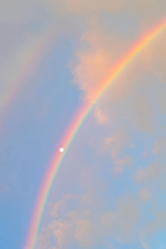Source: unknown
Moon with a rainbow cutting across. More zoomed in on the moon, which is nearly a full moon.