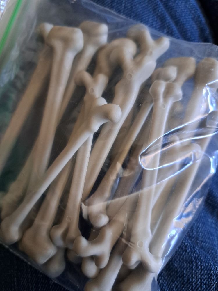 A ziplock baggie of tiny plastic bones