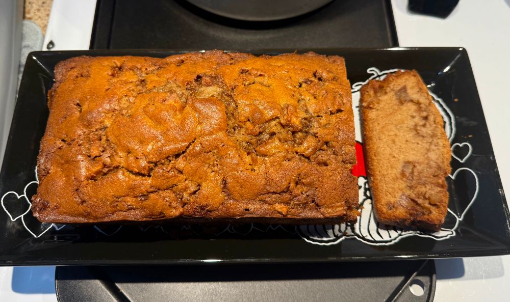 freshly baked apple cinnamon bread loaf ! on a snoopy serving plate 
