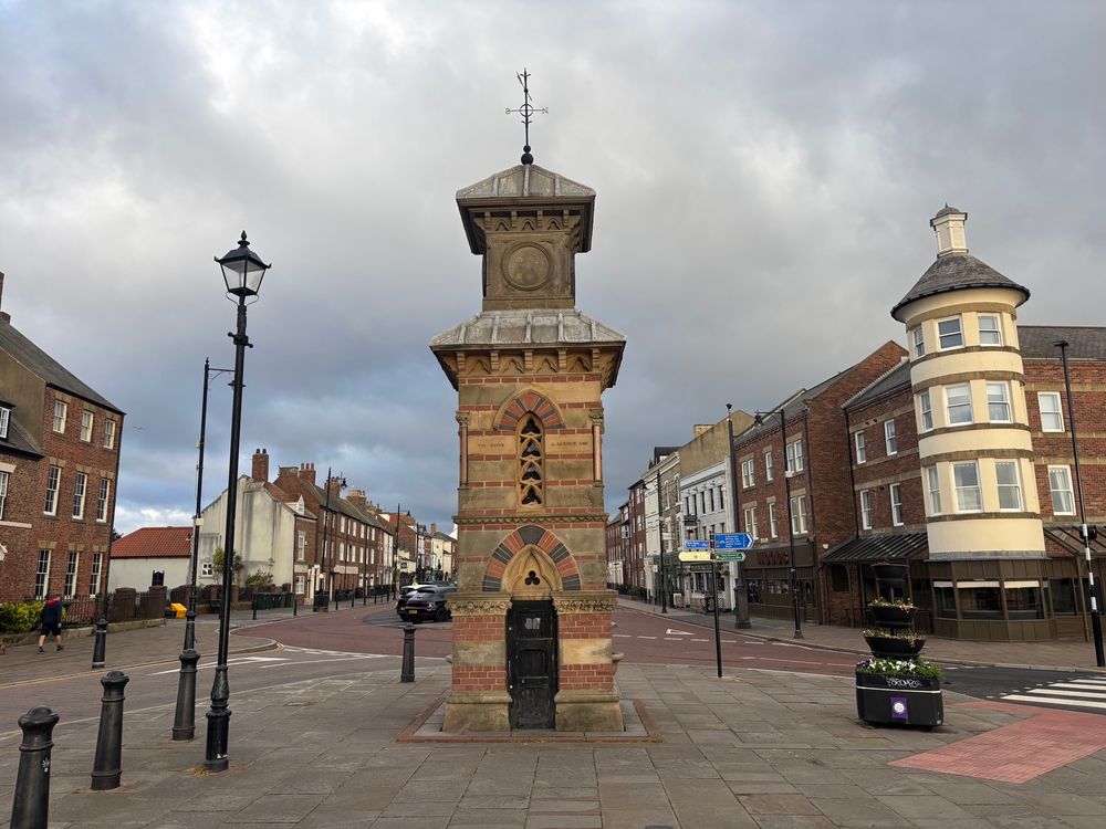 Tynemouth Clocktower, a modest stone building with the Front Street behind.