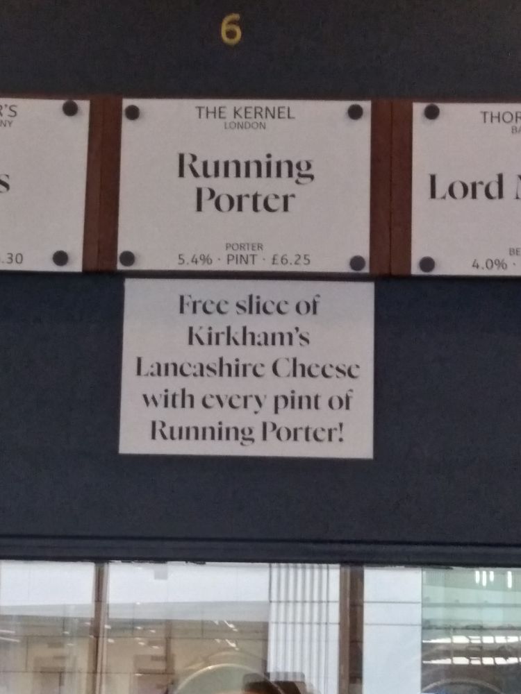 Signs showing London Porter is 5.4% ABV and comes with free slices of Kirkhams Lancashire 