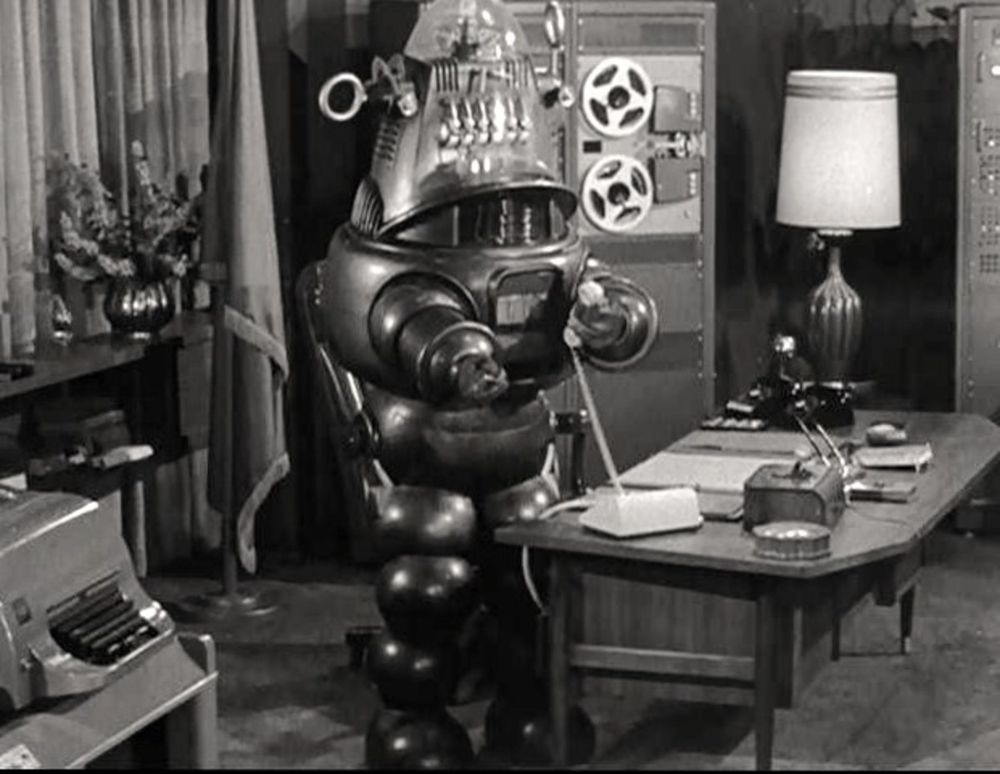 Robby the Robot, working behind a desk.