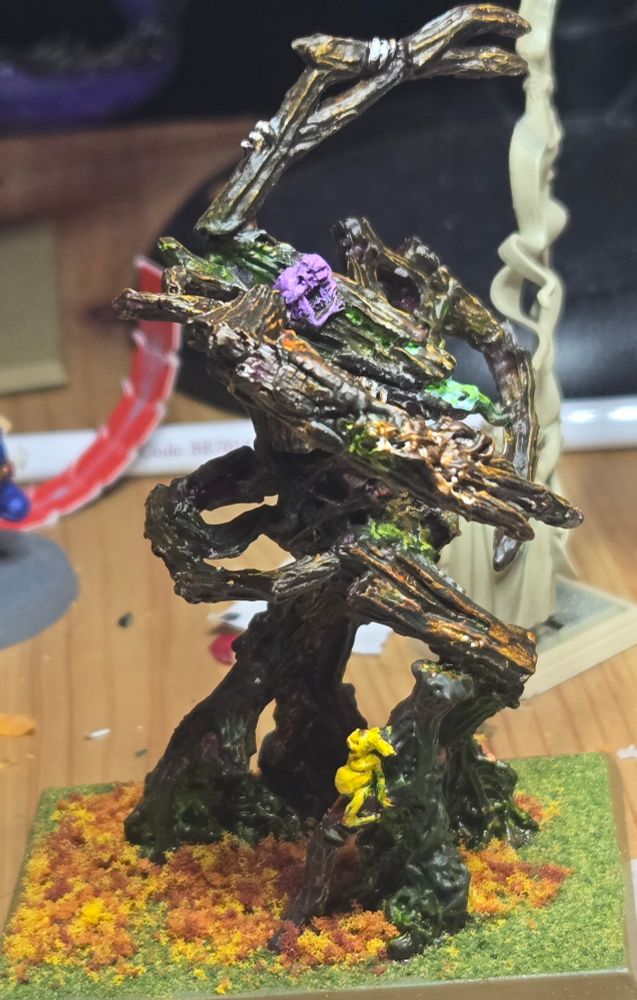 It's a picture of a recently painted Treeman Ancient, a Wood Elf unit from Warhammer Old World