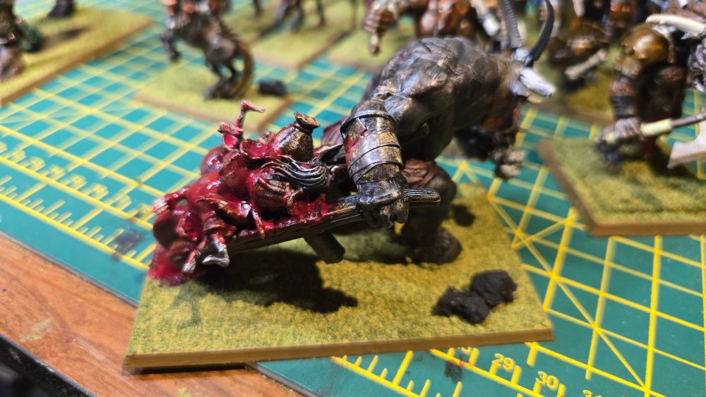 A Minotaur pulling a meat wagon