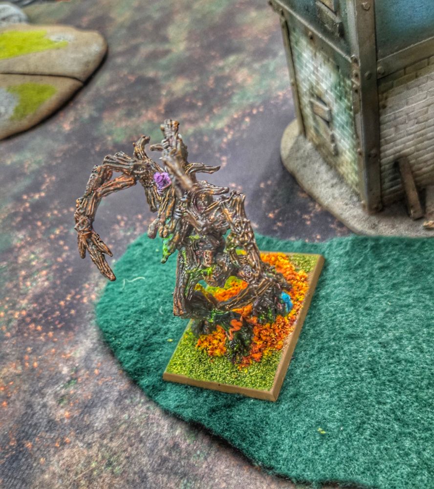 A Treeman Ancient model, standing on some felt. 