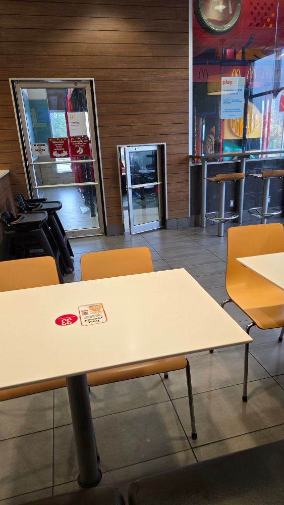 A photo of a regular door beside a door that is half it's height