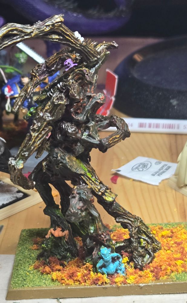 It's a picture of a recently painted Treeman Ancient, a Wood Elf unit from Warhammer Old World