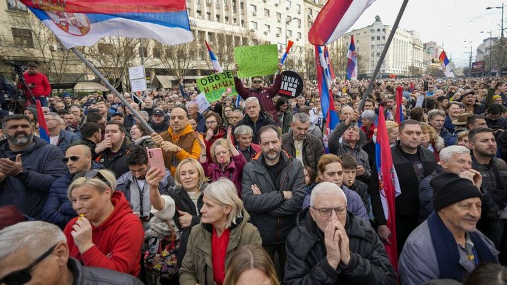 Thousands accuse Serbia’s ruling populists of election fraud at a Belgrade rally