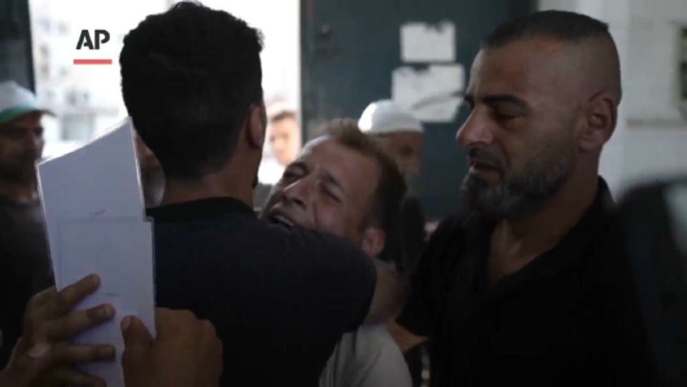 Palestinian father mourns wife and days old twins killed in Israeli bombardment of central Gaza