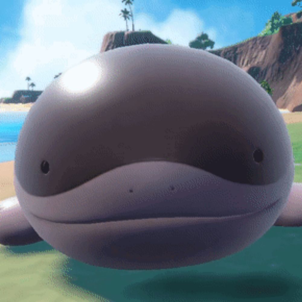 a whale with a hole in its mouth is laying on the grass