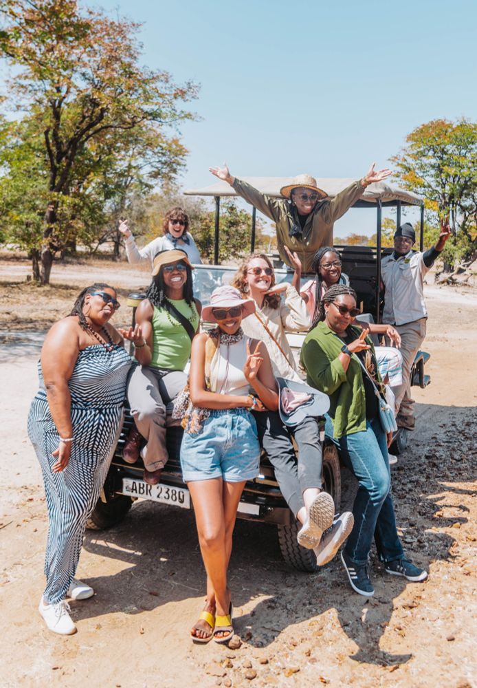 A group of girls posing for a photo while on a girls trip in Botswana