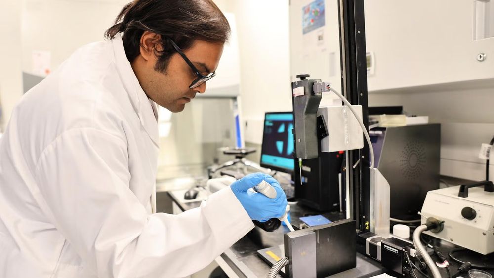 Dr. Surjyasish Mitra, a member of the Waterloo research team, dispenses a soft sphere on a vertical surface in the experiment used to capture a slow rolling motion with high-speed cameras. 