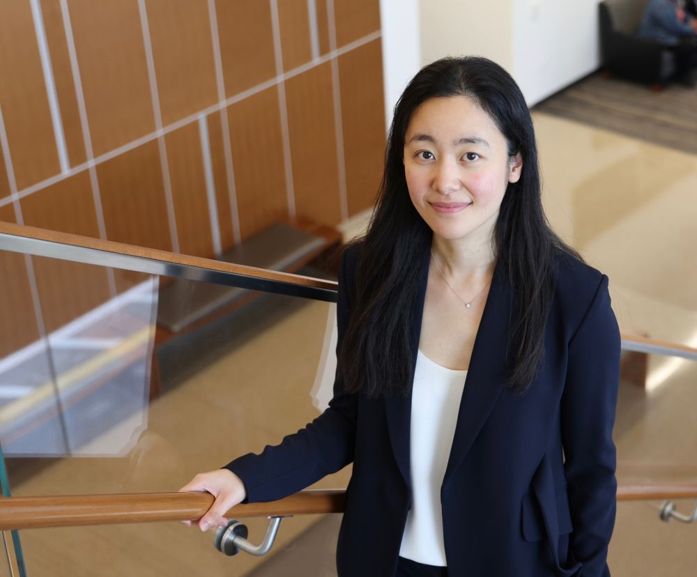 Dr. Shu (Joy) Jiang (PhD ’18) standing on a stairwell