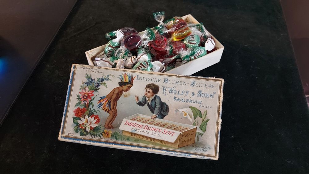 A close-up of some sweets in a vintage box. 