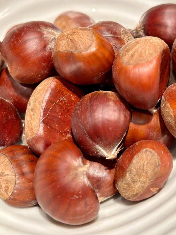 Shelled chestnuts on a white plate