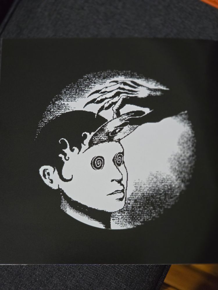 Imaginal Disk Logo, flipside of lyric booklet