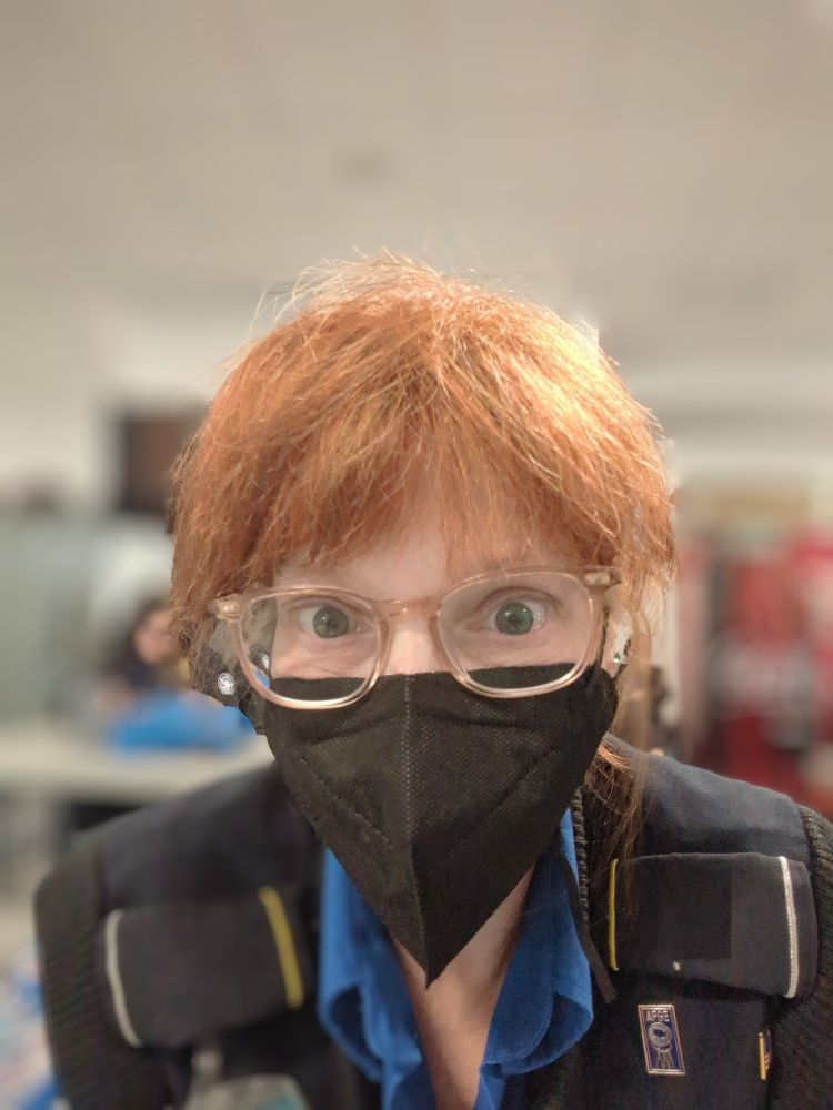 Me wearing my uniform and a protective mask to keep my germs away from coworkers.