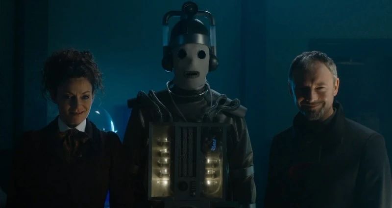 Frame from the Doctor Who story ‘World Enough and Time’ showing two incarnations of the Master and a Mondasian Cyberman.
