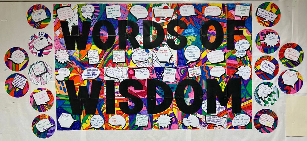 Bulletin board that says “words of wisdom” - it’s a collective mural for students to share what they’ve learned with next year’s incoming students